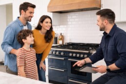 couple with child examining modern kitchen appliances in bright showroom with natural light and casual interaction
